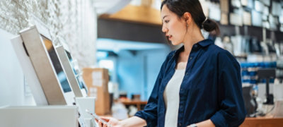 Woman at a self-serve checkout
