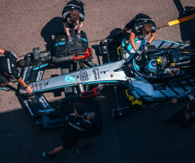 Top view of mechanics working on a pit stop.