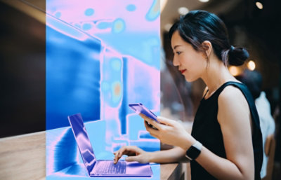 A woman using a phone.