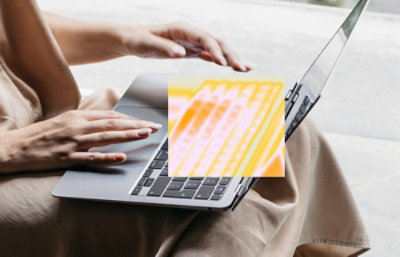 A person typing on a laptop.