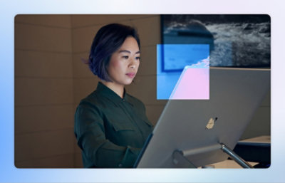 A person sitting at a desk with a laptop.