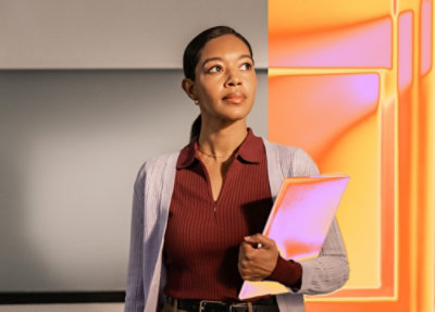 A person holding a folder.