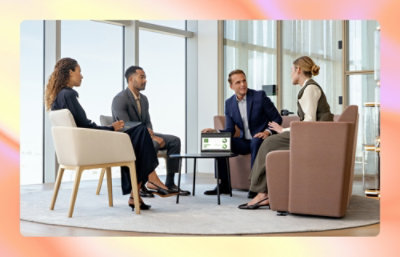 A group of people sitting in a circle indoors.