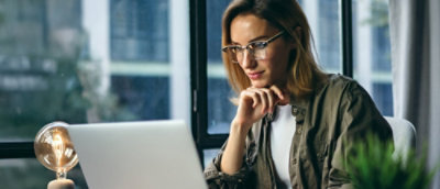 A woman with her hand on her chin.