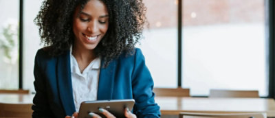A close-up of a person holding a tablet.