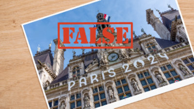 A photo of a building which have a large watch with text PARIS 2024