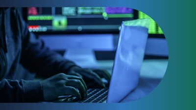 A person typing on a laptop.