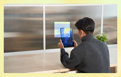 A man holding a tablet.