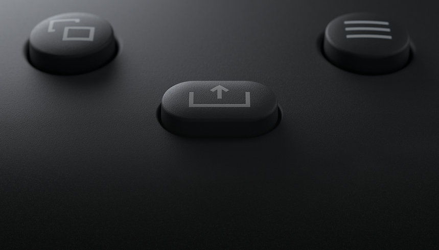 A closeup of the share button on a black XBOX Wireless Controller.