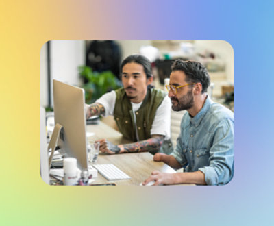 A group of men looking at a computer screen