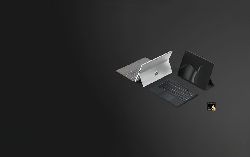 Um Surface Pro para Empresa na cor Platina e um Surface Pro para Empresas na cor Preto, Copilot+ PCs com processadores Snapdragon®, emparelhados com o Teclado Flex para Surface Pro de 13 polegadas para Empresas.