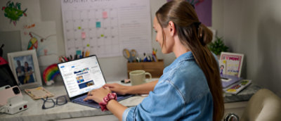 A Person working on a laptop at a desk