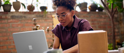 A woman looking at a computer screen