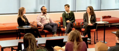 A group of people sitting on chairs.