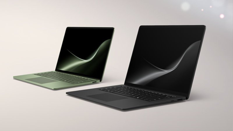 A jade, 13.8-inch Surface Laptop and a black, 15-inch Surface Laptop. 