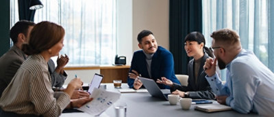 A group of people sitting in a building.