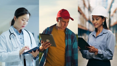Three people checking something in the tablet