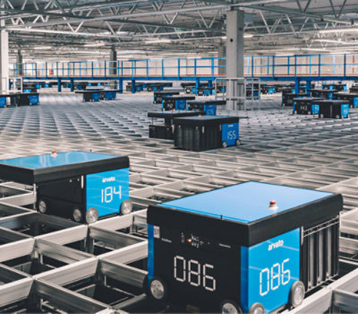 Automated guided vehicles operating in a modern warehouse facility.