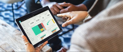 A person pointing at a tablet