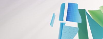 A tablet and a smartphone are displayed on a white surface with pink and white decorative elements