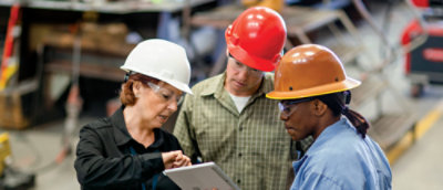 A group of people wearing hard hats