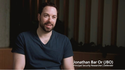 A man in a black shirt is shown with a text overlay displaying Jonathan Bar Or (JBO) Principal Security Researcher | Defender.