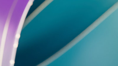 A blue, green, purple surface with a white line.