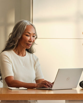 A person typing on a laptop.