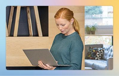 A person holding a laptop.