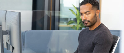 A man looking down at something.