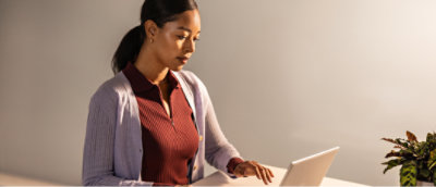 A woman using a laptop.