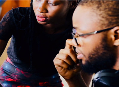 A close-up of men and woman's face.