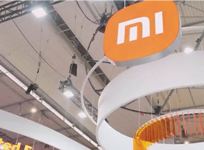  A white sign in a building with the text MI.