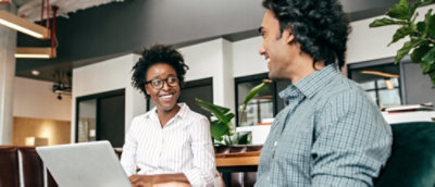 A man and woman smiling.
