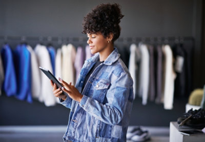A woman holding a tablet.