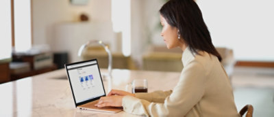 A woman using a laptop.