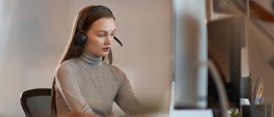 A woman wearing headphones.