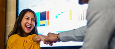 Woman and man shaking hands