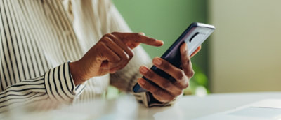 Close of the man using mobile phone