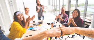 A group of people clapping hands