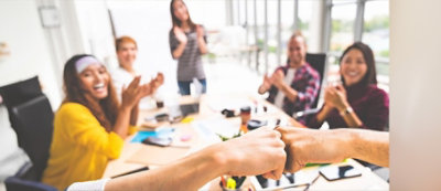 A group of people clapping.