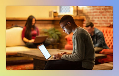 Person staring at a computer in a public place