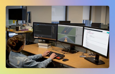 A person using a computer with text visible on the screen.