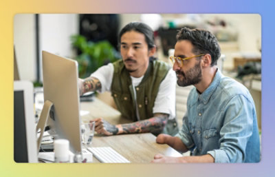 A group of men looking at a computer screen