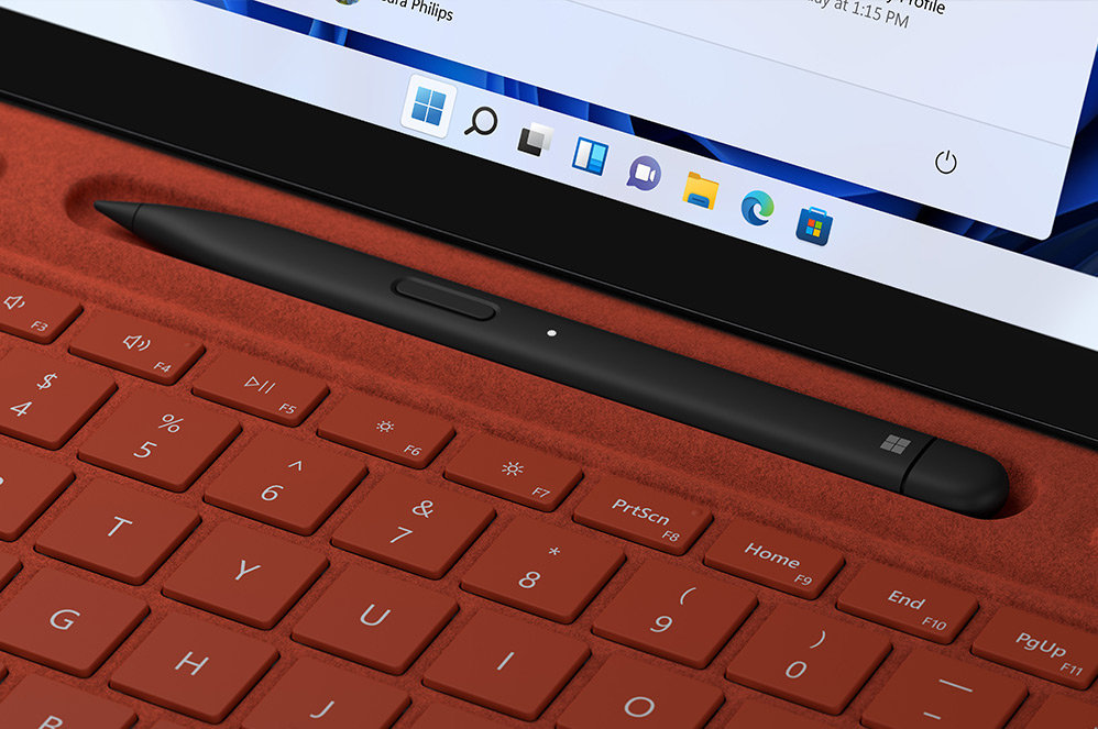 A close up of Surface Slim Pen 2 charging in keyboard slot.