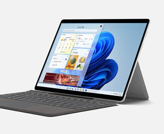 Surface Pro X shown as a laptop with Windows 11 home screen