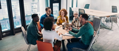 A person and person looking at a computer
