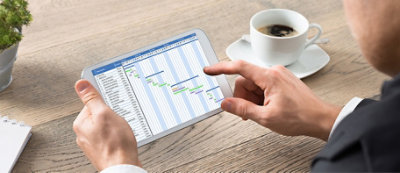 A person holding a tablet with a screen on it