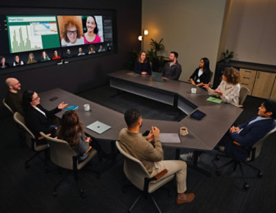 A Group of people sitting in a conference room.