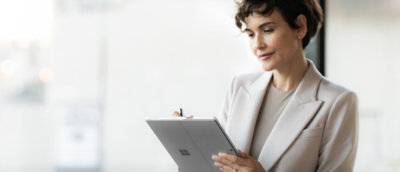 A person holding a tablet.